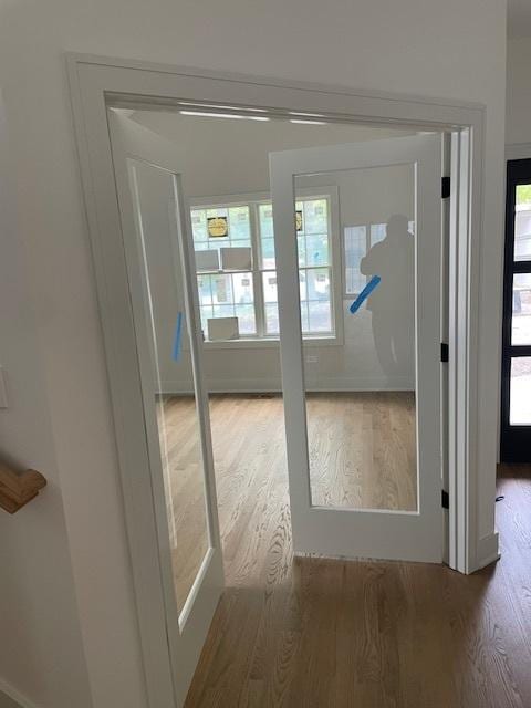 1672 Huntington Ln, Highland Park, IL 60035 - doorway to outside featuring wood finished floors, plenty of natural light, and baseboards