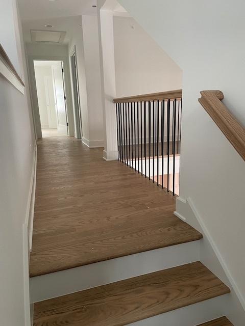 1672 Huntington Ln, Highland Park, IL 60035 - stairs with attic access, wood finished floors, and baseboards