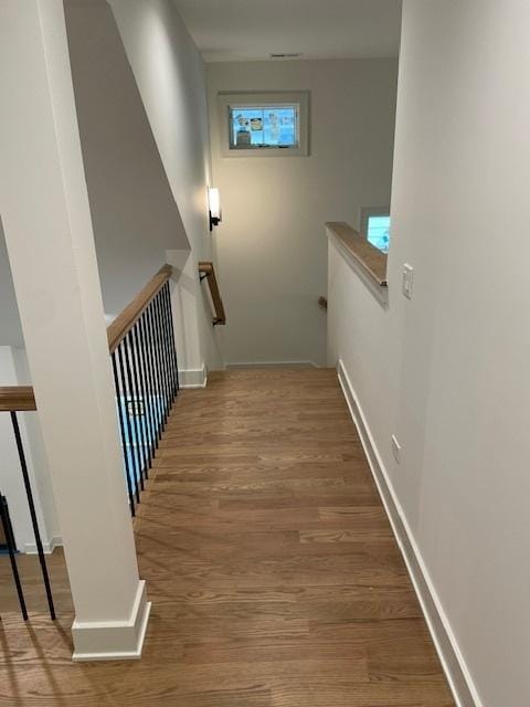 1672 Huntington Ln, Highland Park, IL 60035 - hall featuring an upstairs landing, wood finished floors, and baseboards