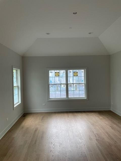 1672 Huntington Ln, Highland Park, IL 60035 - spare room featuring vaulted ceiling, wood finished floors, and baseboards