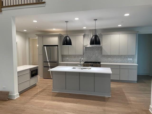 1672 Huntington Ln, Highland Park, IL 60035 - kitchen featuring freestanding refrigerator, gray cabinets, a sink, built in microwave, and light countertops