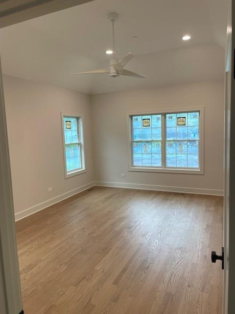 1672 Huntington Ln, Highland Park, IL 60035 - unfurnished room with baseboards, wood finished floors, a ceiling fan, and recessed lighting
