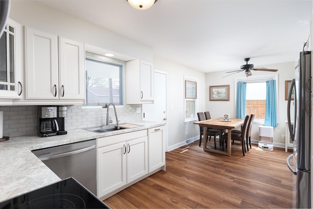 208 N Fremont St, Naperville, IL 60540 - kitchen with a sink, stainless steel appliances, dark wood-type flooring, white cabinetry, and backsplash