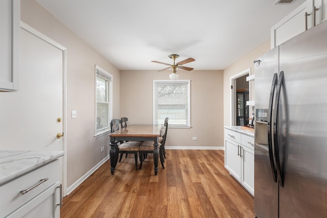 208 N Fremont St, Naperville, IL 60540 - dining room with light wood finished floors, baseboards, and ceiling fan