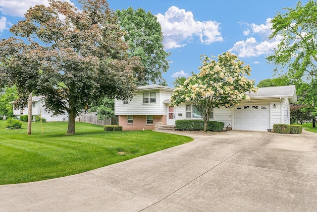 404 Maple Ln, Monticello, IL 61856 - split level home with a garage, concrete driveway, and brick siding
