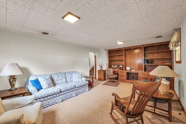 404 Maple Ln, Monticello, IL 61856 - living area with carpet flooring, stairway, and built in shelves