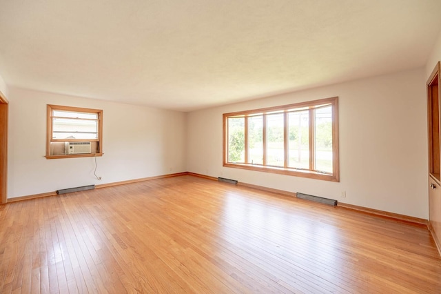 408 E Fabyan Pkwy, Batavia, IL 60510 - empty room featuring plenty of natural light, light wood-type flooring, and baseboards