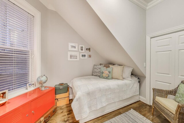 1908 N Whipple St Unit 2, Chicago, IL 60647 - bedroom with wood finished floors, ornamental molding, baseboards, and lofted ceiling