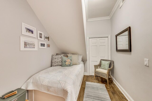 1908 N Whipple St Unit 2, Chicago, IL 60647 - bedroom with dark wood-style flooring, crown molding, baseboards, and vaulted ceiling