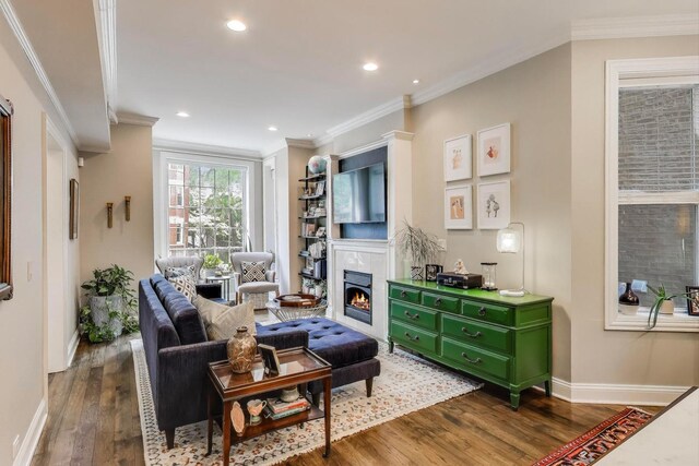 1908 N Whipple St Unit 2, Chicago, IL 60647 - living room featuring wood finished floors, a warm lit fireplace, baseboards, recessed lighting, and ornamental molding