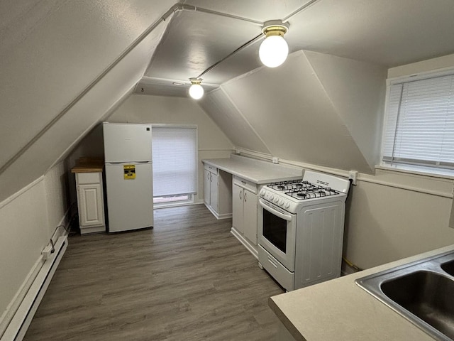 572 Walnut Ave, Elgin, IL 60123 - kitchen with white appliances, a baseboard heating unit, vaulted ceiling, dark wood-style flooring, and a baseboard radiator