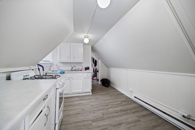 572 Walnut Ave, Elgin, IL 60123 - laundry area with a baseboard radiator, light wood finished floors, and a sink