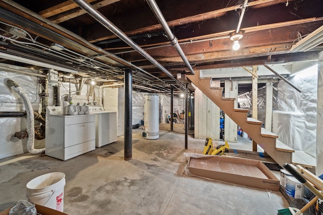 572 Walnut Ave, Elgin, IL 60123 - unfinished basement featuring gas water heater, washer and clothes dryer, and stairway