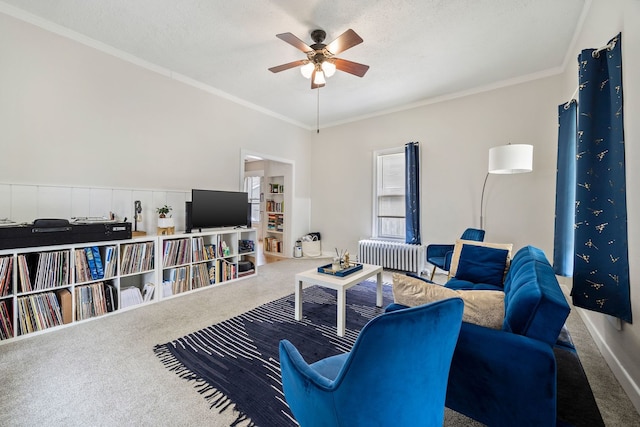 572 Walnut Ave, Elgin, IL 60123 - carpeted living area featuring radiator heating unit, ceiling fan, ornamental molding, and baseboards