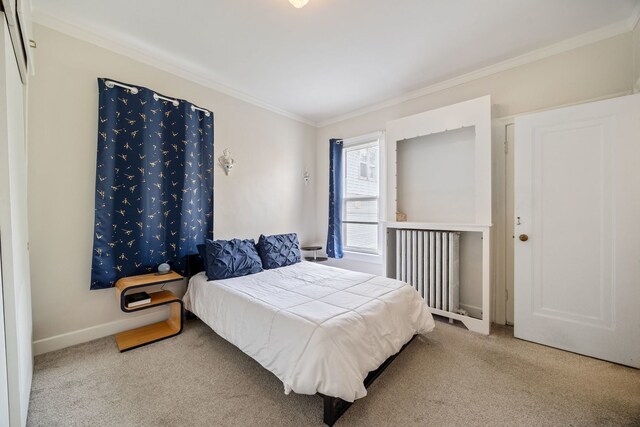 572 Walnut Ave, Elgin, IL 60123 - carpeted bedroom featuring ornamental molding and baseboards