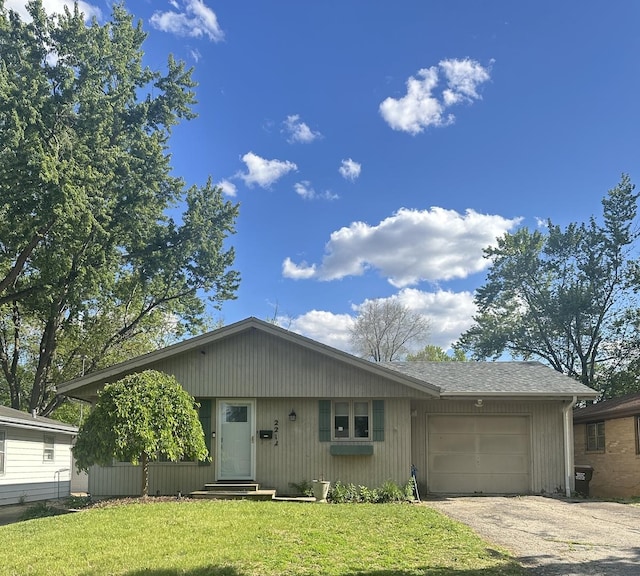 2212 Barton Blvd, Rockford, IL 61103 - view of front of house with an attached garage, driveway, a front lawn, and entry steps
