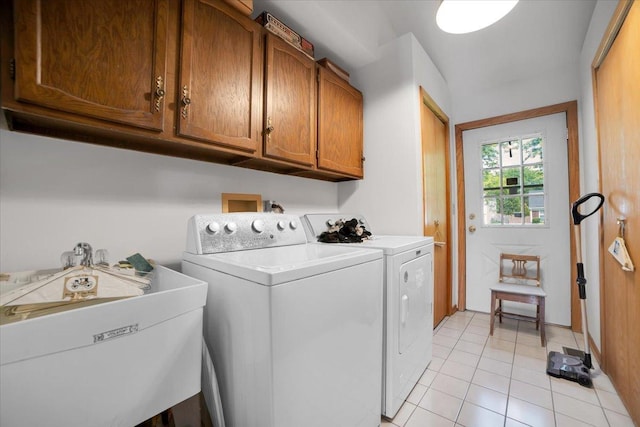 731 Viola Ct, Schaumburg, IL 60194 - washroom with washing machine and clothes dryer, light tile patterned flooring, and cabinet space