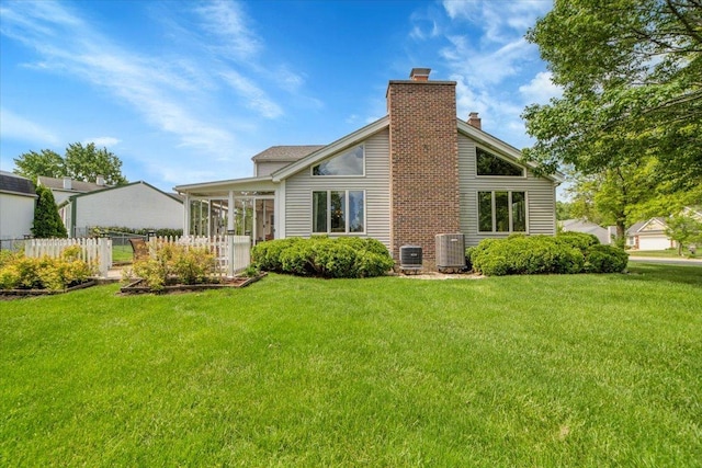 731 Viola Ct, Schaumburg, IL 60194 - rear view of house with a chimney and a sunroom