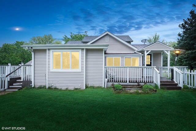 41672 N Dot Pl, Antioch, IL 60002 - back of house with a lawn, roof with shingles, and covered porch