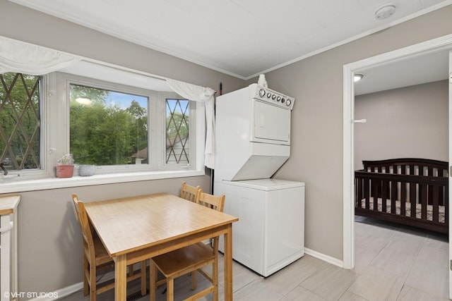 41672 N Dot Pl, Antioch, IL 60002 - laundry room with stacked washer / drying machine, ornamental molding, and baseboards