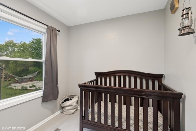 41672 N Dot Pl, Antioch, IL 60002 - bedroom featuring baseboards and a nursery area