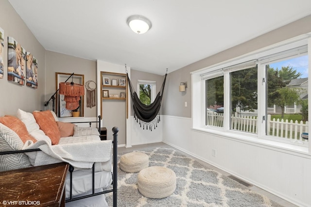 41672 N Dot Pl, Antioch, IL 60002 - living area featuring vaulted ceiling, plenty of natural light, and a wainscoted wall