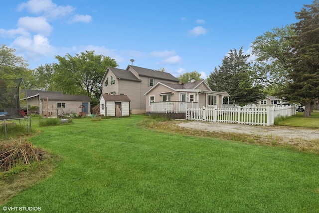 41672 N Dot Pl, Antioch, IL 60002 - rear view of property with a trampoline and a deck