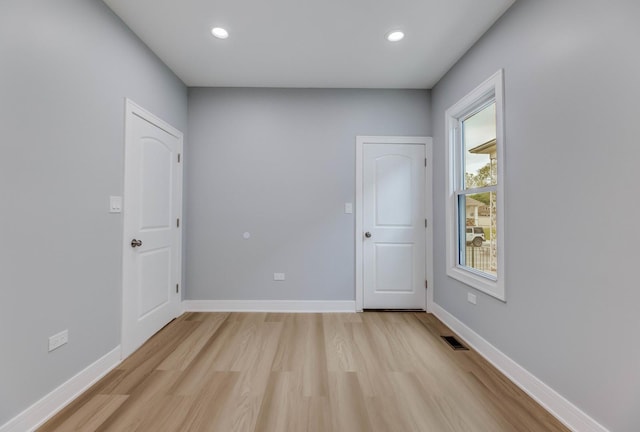 5731 S Damen Ave, Chicago, IL 60636 - unfurnished room featuring light wood-style flooring, baseboards, and recessed lighting