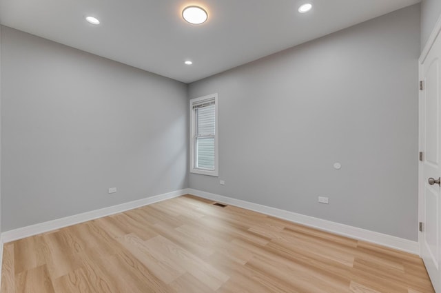 5731 S Damen Ave, Chicago, IL 60636 - unfurnished room featuring light wood-style flooring, baseboards, and recessed lighting