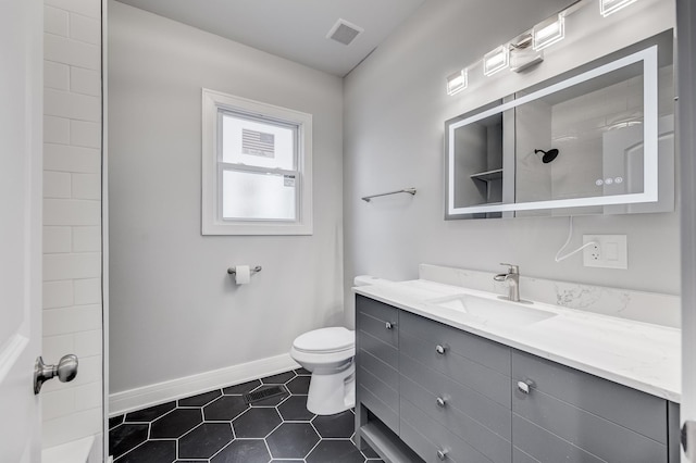 5731 S Damen Ave, Chicago, IL 60636 - bathroom with vanity, toilet, tile patterned flooring, baseboards, and a shower