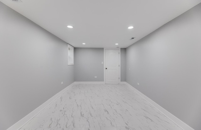 5731 S Damen Ave, Chicago, IL 60636 - finished basement with recessed lighting, light marble finish floors, and baseboards