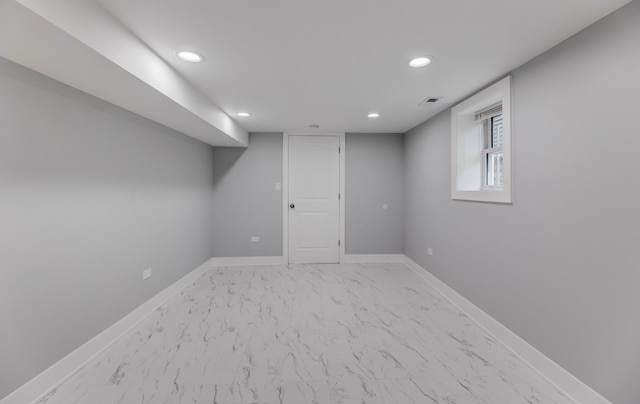 5731 S Damen Ave, Chicago, IL 60636 - below grade area with recessed lighting, light marble finish floors, and baseboards