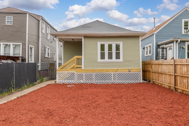5731 S Damen Ave, Chicago, IL 60636 - rear view of property with a shingled roof
