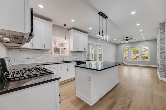 5731 S Damen Ave, Chicago, IL 60636 - kitchen featuring a sink, dark countertops, ceiling fan, backsplash, and recessed lighting