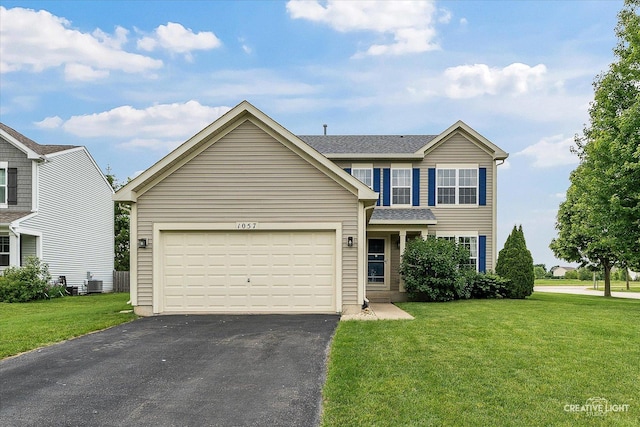 1057 Wright Ct, Plano, IL 60545 - traditional-style home with driveway, a front lawn, a garage, and cooling unit