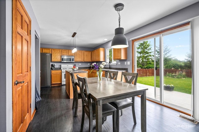 1057 Wright Ct, Plano, IL 60545 - dining space with dark wood-style floors and recessed lighting