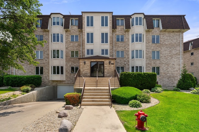 3640 186th St Unit 101, Lansing, IL 60438 - view of apartment building / complex featuring driveway