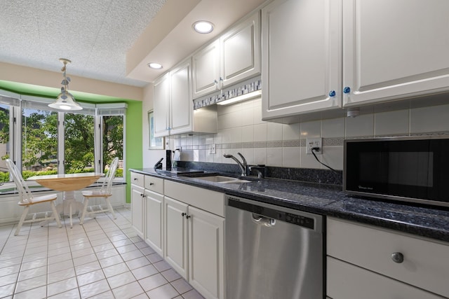 3640 186th St Unit 101, Lansing, IL 60438 - kitchen featuring dishwasher, a sink, light tile patterned flooring, white cabinetry, and recessed lighting
