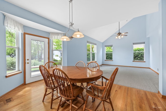 3151 Sawgrass Dr, Aurora, IL 60502 - dining space with baseboards, light wood-style floors, and high vaulted ceiling