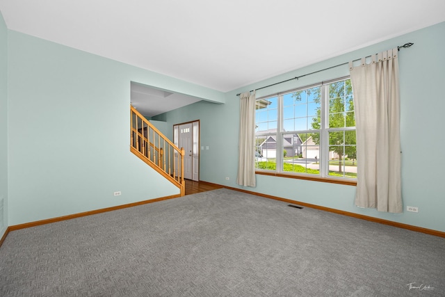 3151 Sawgrass Dr, Aurora, IL 60502 - carpeted empty room featuring baseboards and stairway