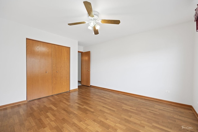 3151 Sawgrass Dr, Aurora, IL 60502 - unfurnished bedroom featuring light wood-style floors, a closet, baseboards, and a ceiling fan