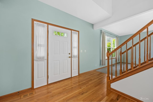 3151 Sawgrass Dr, Aurora, IL 60502 - entrance foyer with light wood-style flooring, beam ceiling, stairway, and baseboards