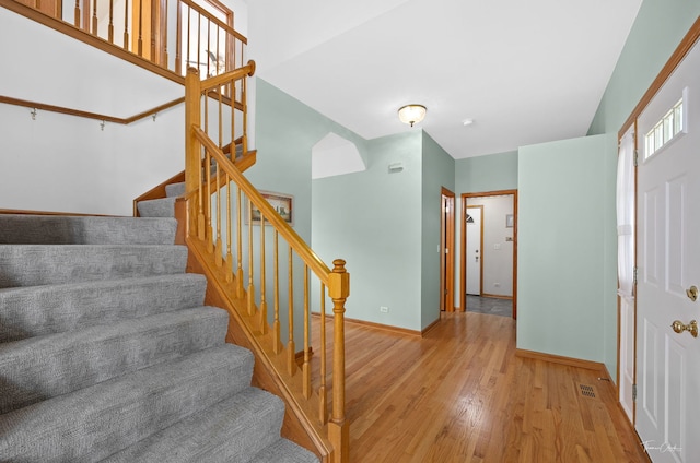 3151 Sawgrass Dr, Aurora, IL 60502 - entrance foyer featuring wood finished floors, baseboards, and stairway