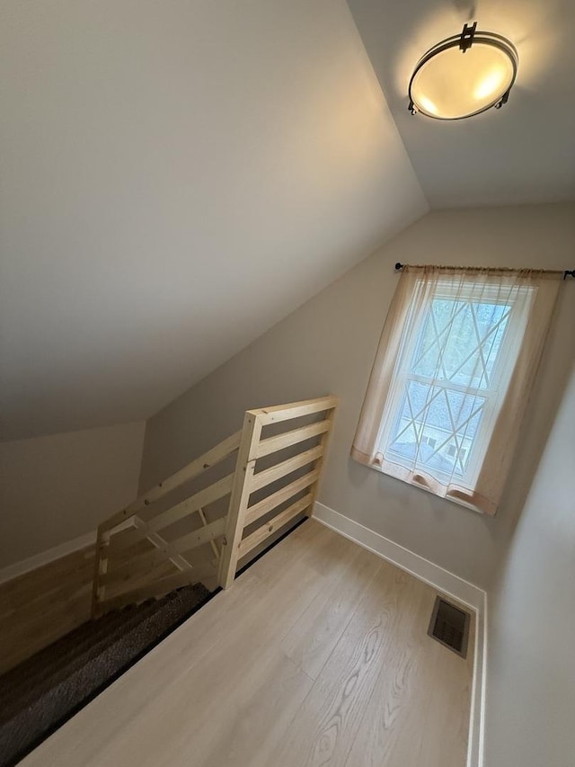 5301 S Mcvicker Ave, Chicago, IL 60638 - bonus room with lofted ceiling, light wood finished floors, and baseboards