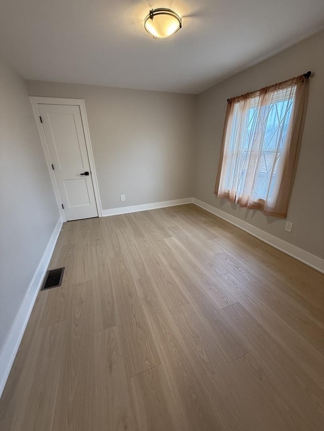 5301 S Mcvicker Ave, Chicago, IL 60638 - spare room with wood finished floors and baseboards