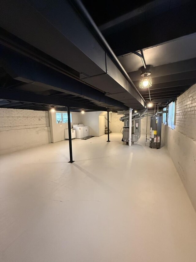 5301 S Mcvicker Ave, Chicago, IL 60638 - below grade area with water heater, washing machine and dryer, and heating unit