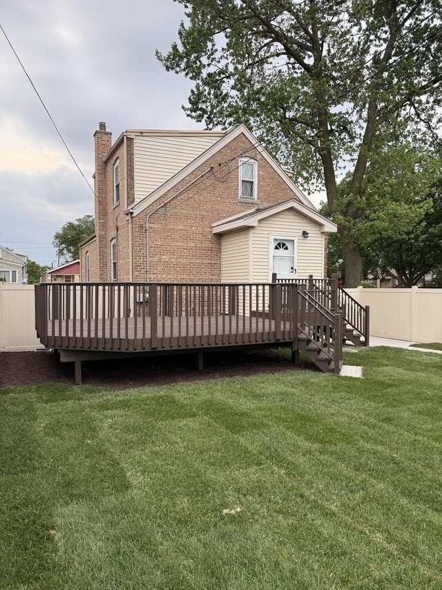 5301 S Mcvicker Ave, Chicago, IL 60638 - back of property featuring a wooden deck, brick siding, and a chimney