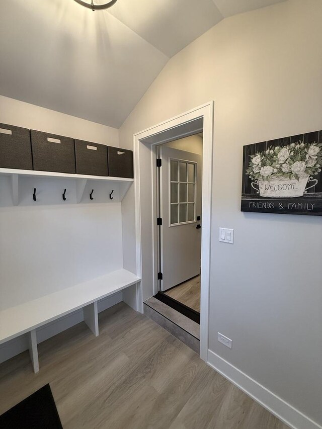 5301 S Mcvicker Ave, Chicago, IL 60638 - mudroom featuring wood finished floors, vaulted ceiling, and baseboards