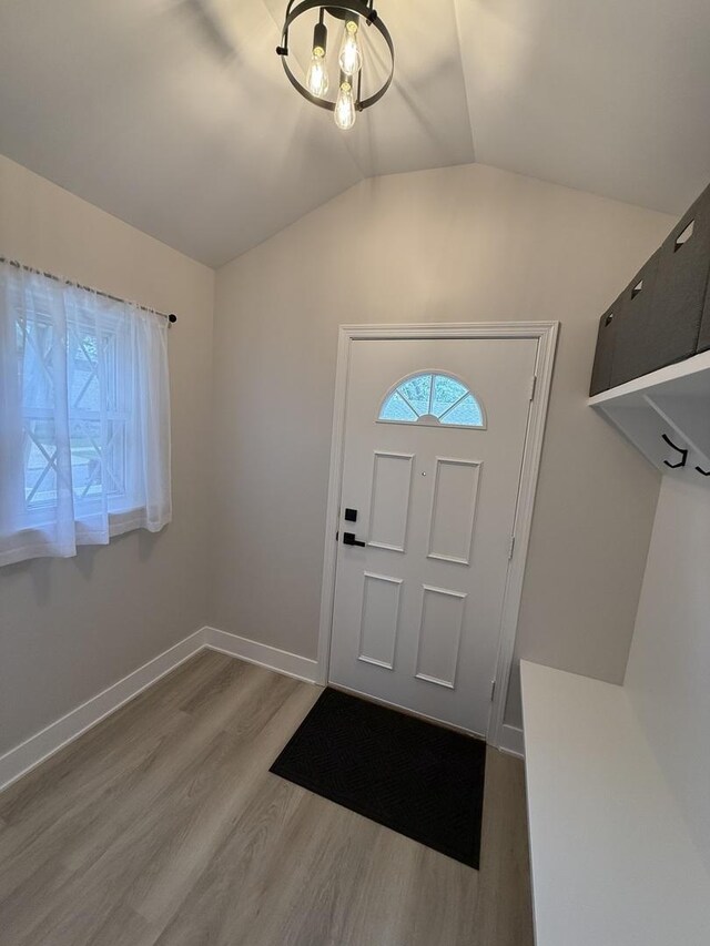 5301 S Mcvicker Ave, Chicago, IL 60638 - foyer entrance with wood finished floors, lofted ceiling, and baseboards