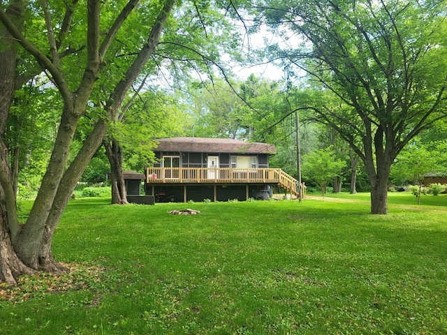 2820 S Brooks Island Rd, Oregon, IL 61061 - rear view of house with a deck, a lawn, and a forest view